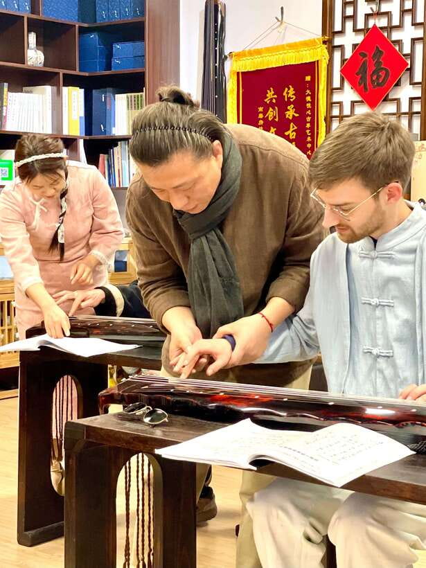 Beijing Hands-On Culture Tour: Tea, Instrument, Calligraphy - The Guqin lesson gives you a real turn at the strings