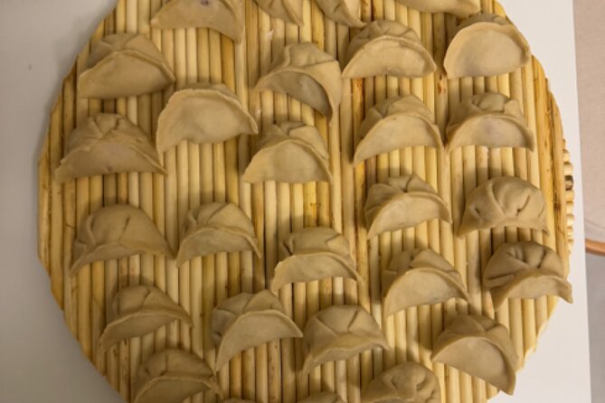 Dumpling Cooking Class and Local Market Tour - Booking and cancellation details