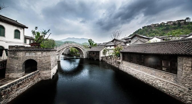 Private Tour to Gubei Water Town and Simatai Great Wall with Cable Car and Lunch - Gubei Water Town: canals, themed streets, and modern recreation